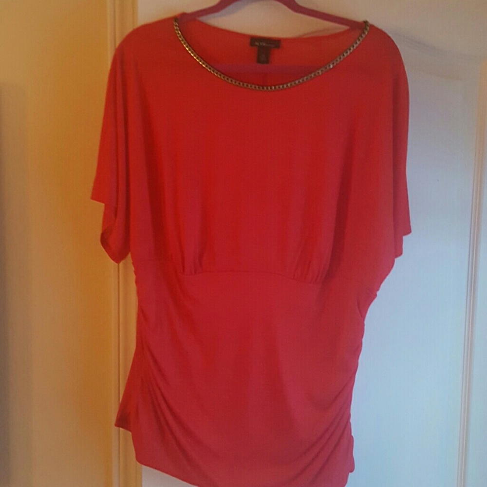 Blouse with gold chain attached